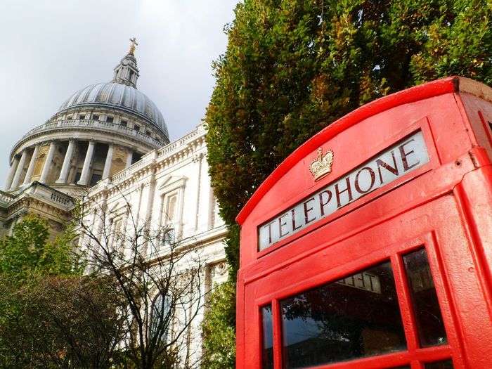 Low angle view of telephone booth against st paul cathedral
