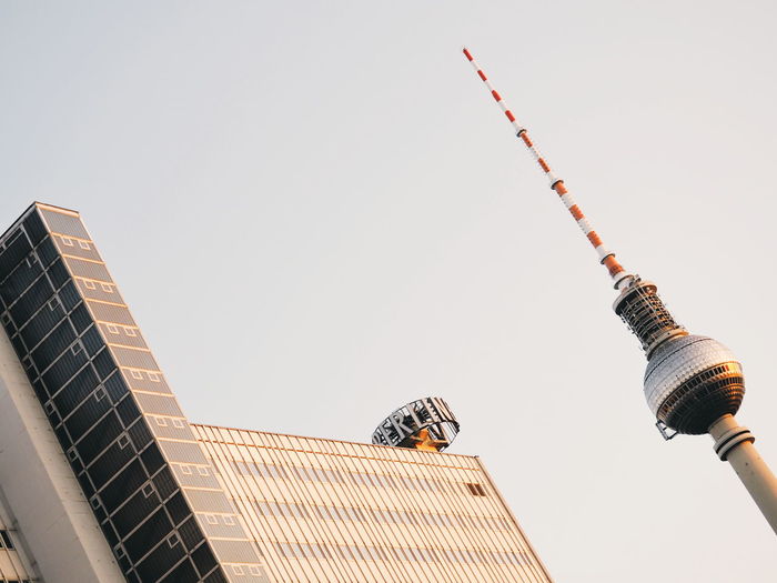 Low angle view of fernsehturm against clear sky