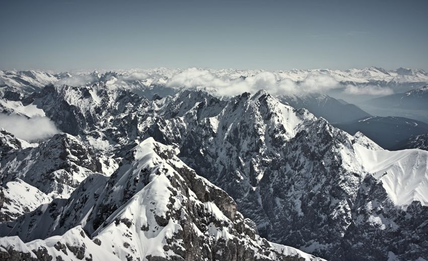 Scenic view of snowcapped mountains against sky