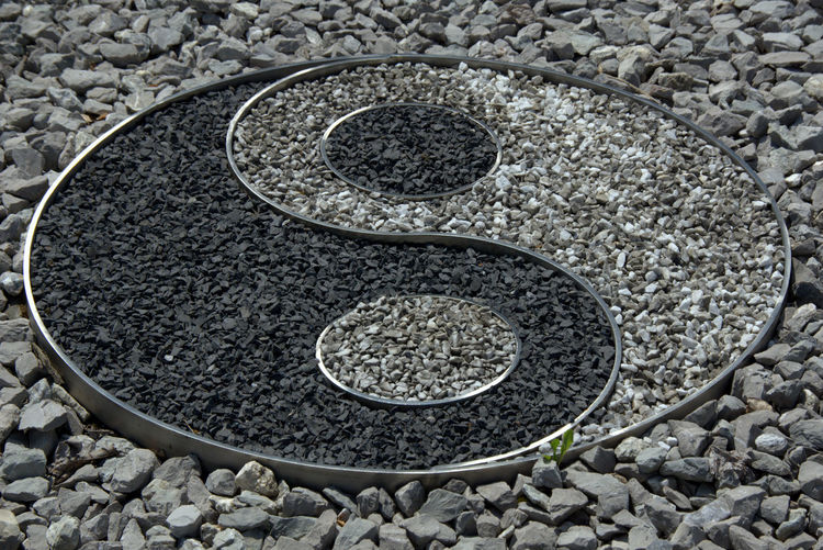Close-up of yin yang symbol on rock