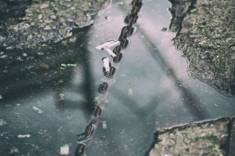 High angle view of chain on water