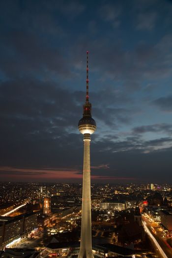 Fernsehturm in illuminated city at night