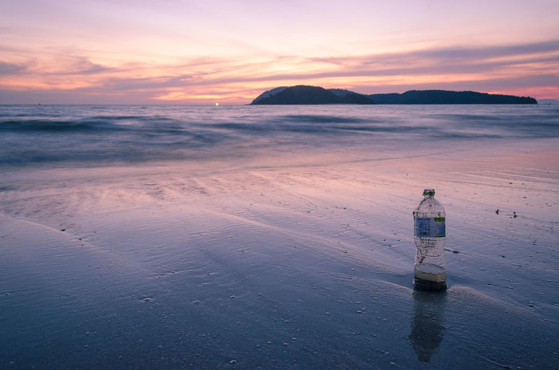 Empty bottle on beach