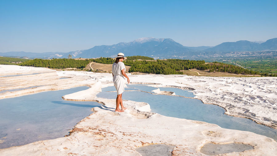 Natural travertine pools and terraces in pamukkale. cotton castle in southwestern turkey