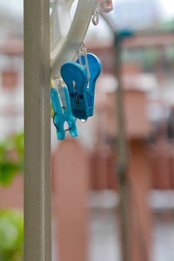 Close-up of clothespin hanging outdoors