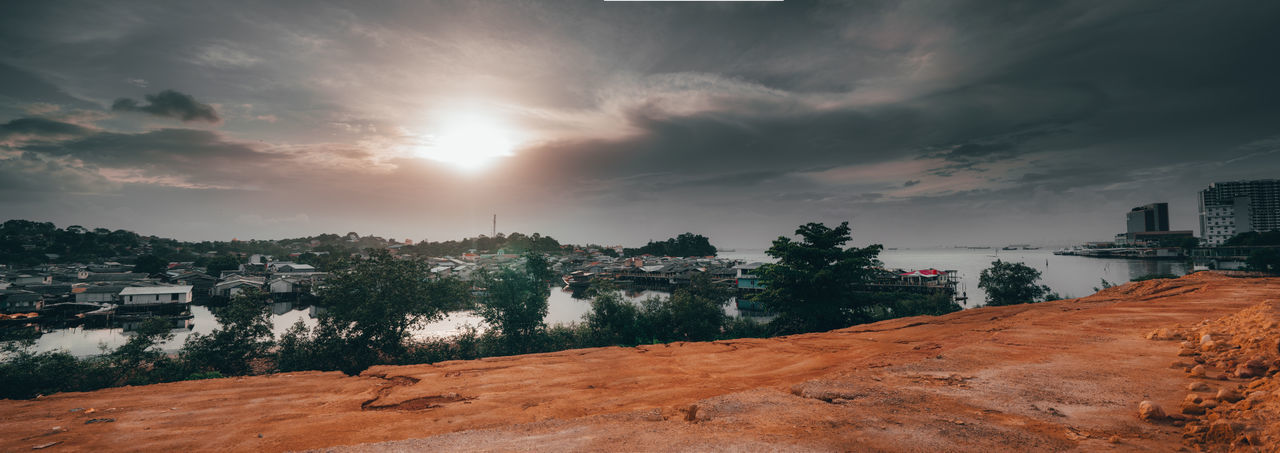 Panoramic view of buildings against sky during sunset