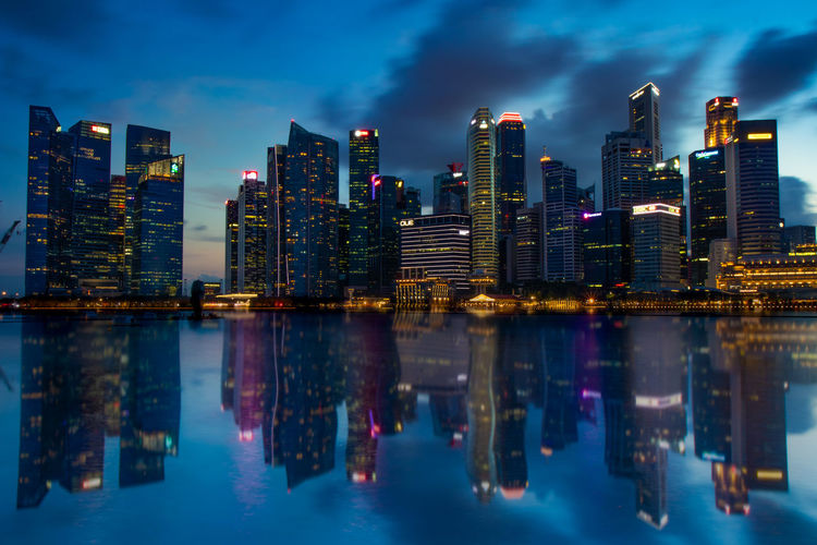 Reflection of illuminated buildings in city