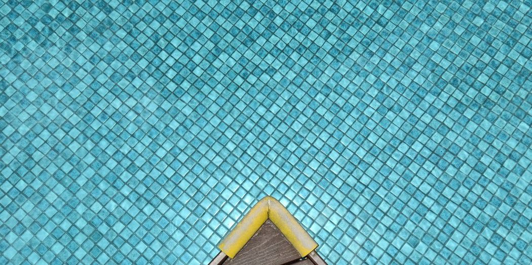 Low angle view of swimming pool against building