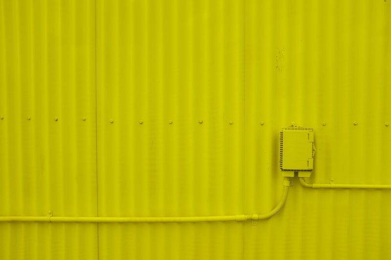 Close-up of yellow telephone connection.