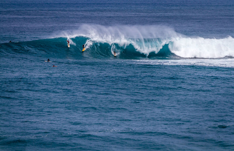 People surfing in sea