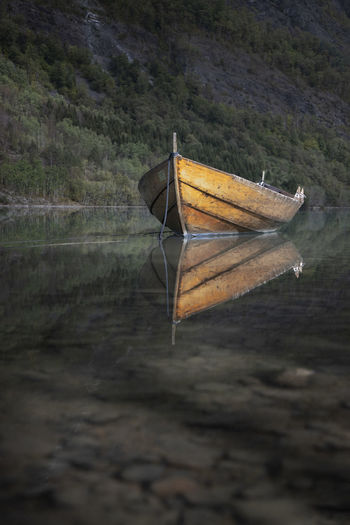 Sailboat floating on lake