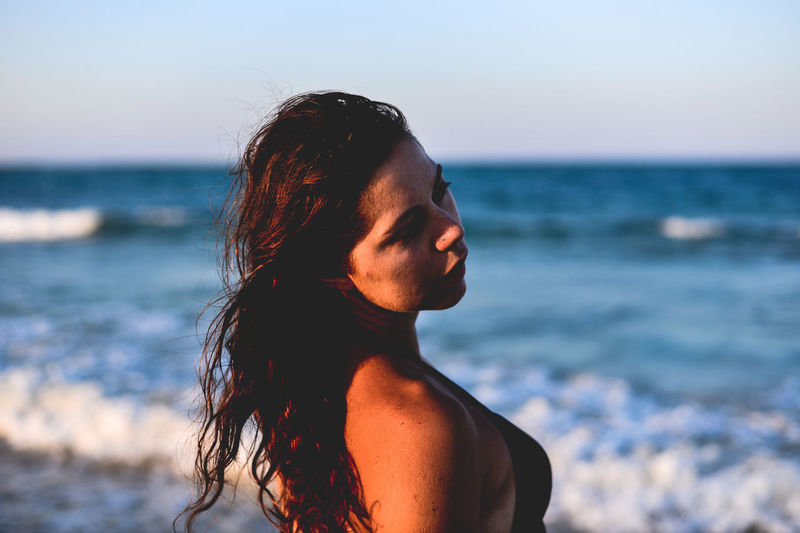 Close-up of young woman at beach