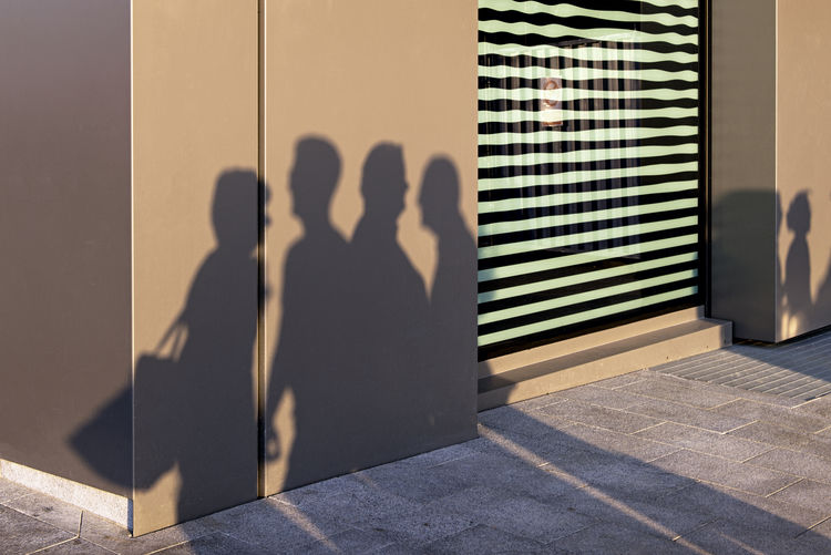 Shadow of people on wall