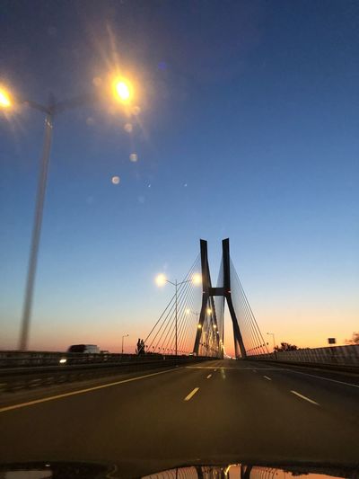 View of suspension bridge against sky during sunset