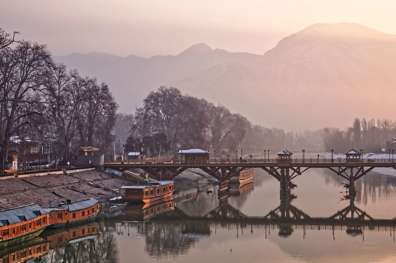 Bridge over river against sky during sunrise, srinagar kashmir 