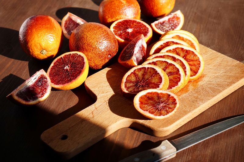 Close-up of oranges on cutting board