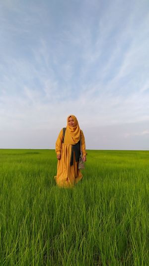 View of person in field against sky