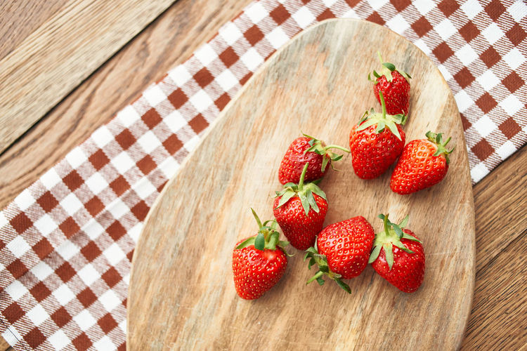 High angle view of strawberries on table