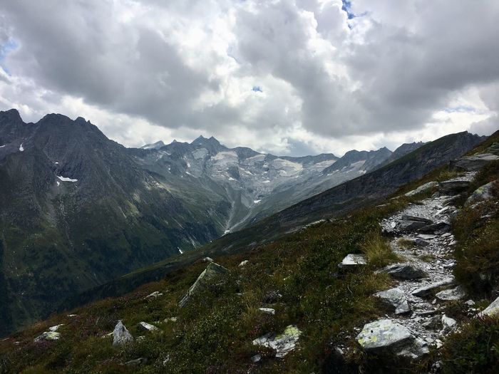 Scenic view of mountains against cloudy sky