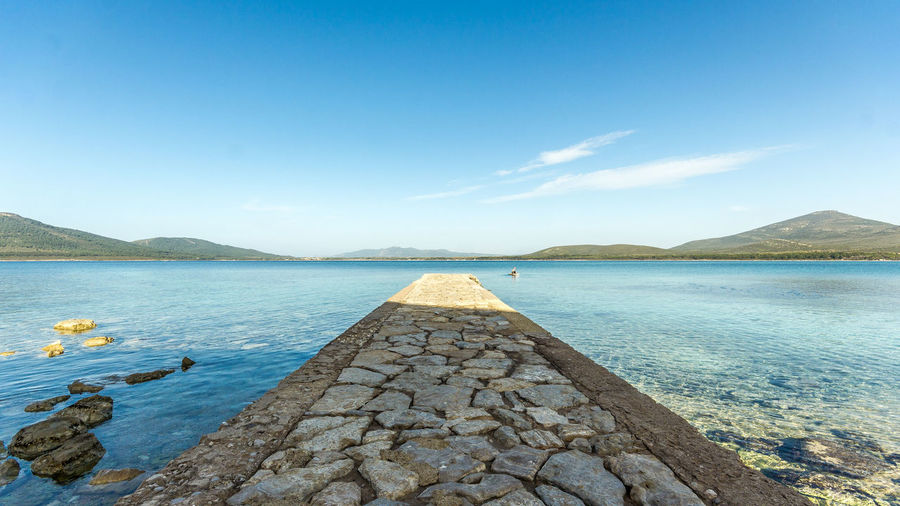 Scenic view of sea against blue sky