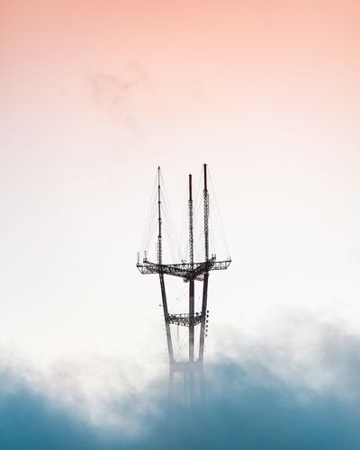 Aerial view of crane during foggy weather at sunset