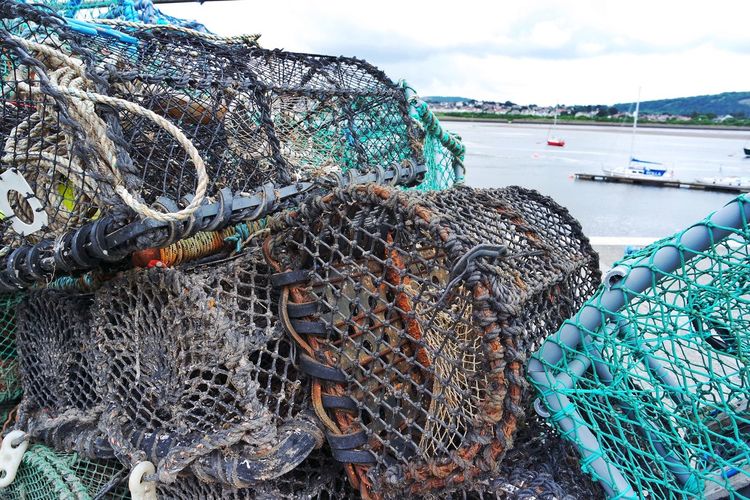 Stack of crab pots against lake