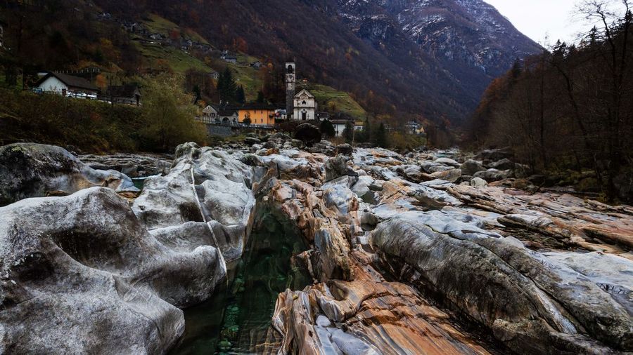 Stream flowing through rocks in mountains