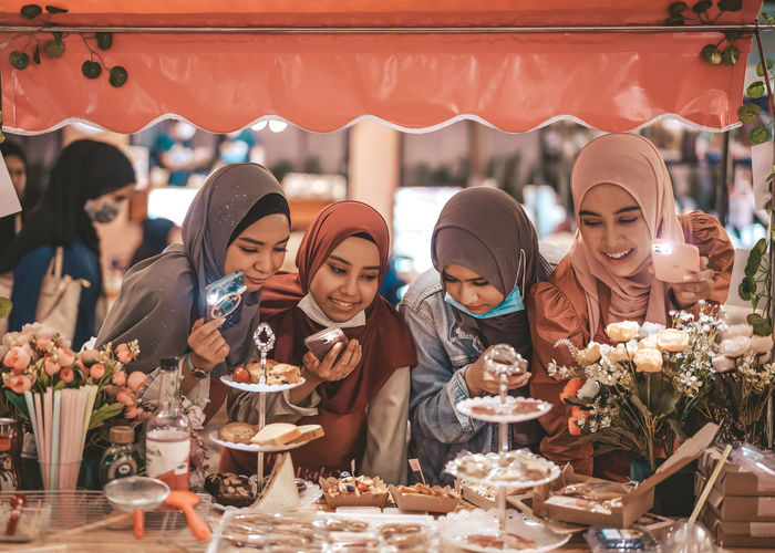 Group of people happy in choosing the dessert