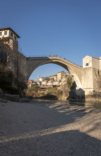 Bridge over river against clear sky