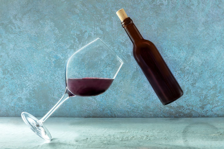 Wineglass on glass of bottle