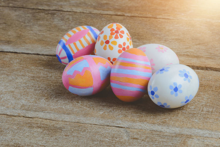 High angle view of multi colored eggs on table