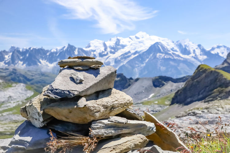 Stack of rocks on mountain against sky and the mont-blanc in france. 