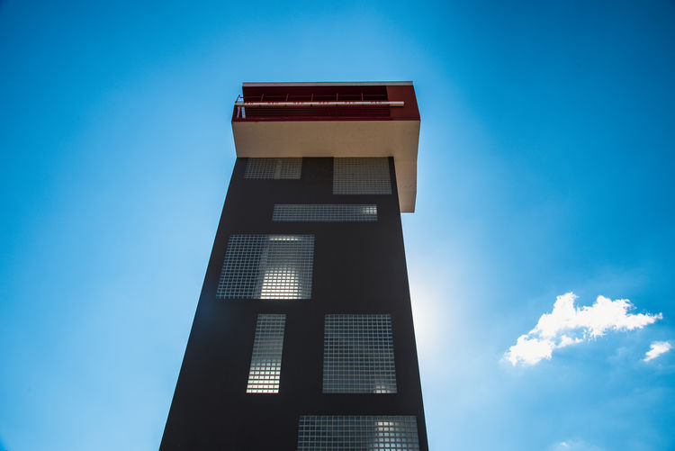 Low angle view of building against blue sky