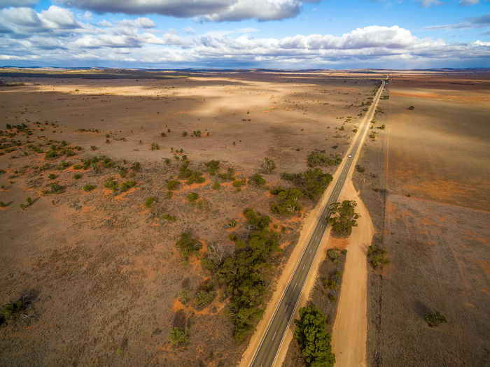 Straight rural highway passing through desert in south australia - aerial view