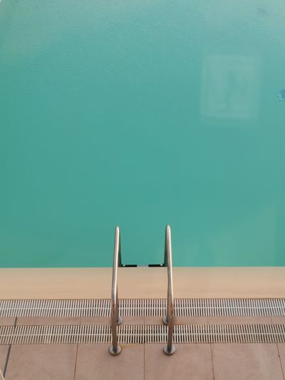 High angle view of ladder in swimming pool