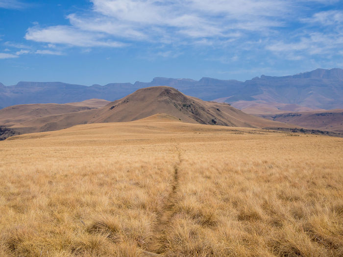 View of landscape against cloudy sky