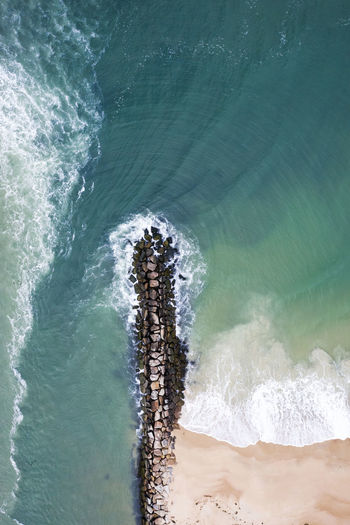 Aerial view of a jetty in new england