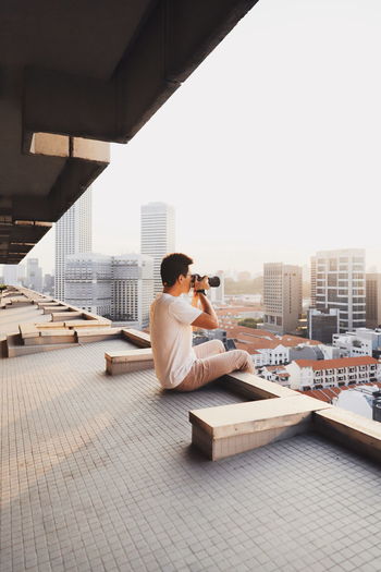 Man photographing cityscape
