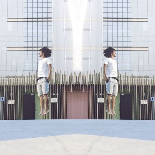 Full length of woman standing by railing