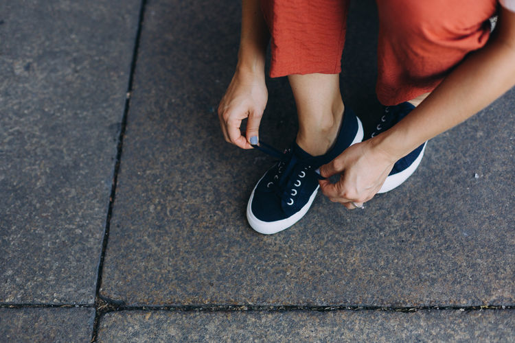 Low section of woman legs on street