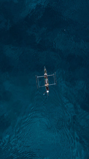 Aerial view of outrigger in sea