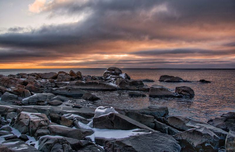 Scenic view of sea against dramatic sky
