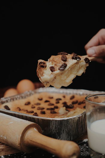 Close-up of person preparing cake