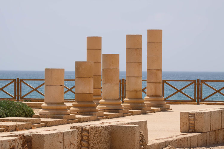 Columns at caesarea maritima against clear sky