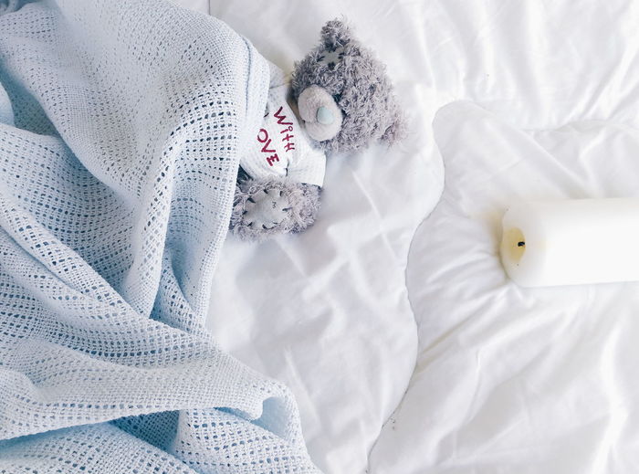 High angle view of soft toy in bed