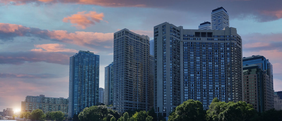 Modern buildings in city against sky