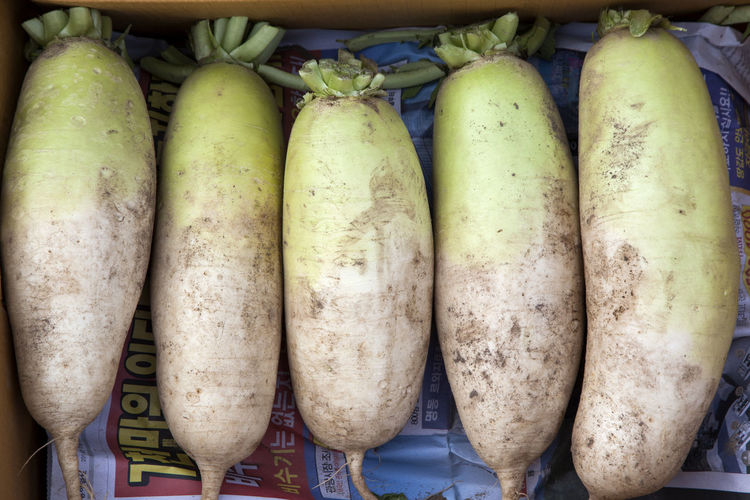 Directly above shot of daikon radish for sale at market stall