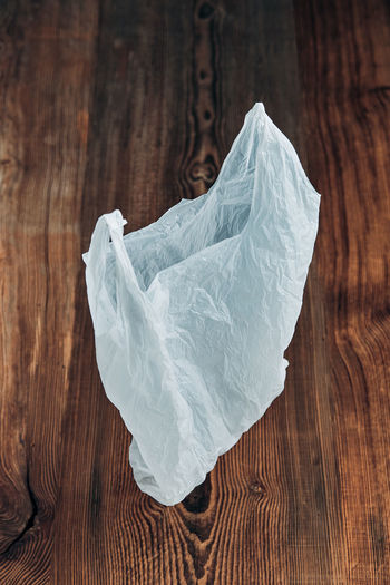 Close-up of ice plastic bag against black background