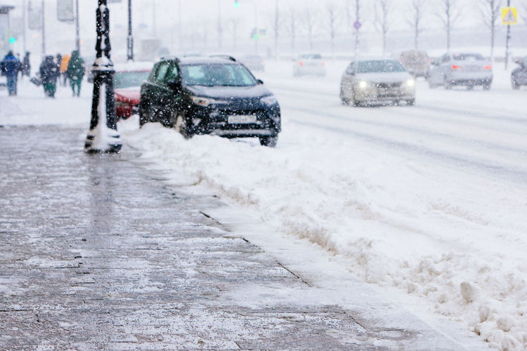 De-icing chemicals on winter road. reagent - technical salt will make the road safe.winter weather