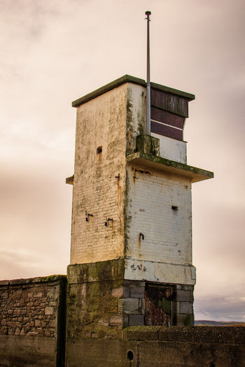 Low angle view of old building against sky. coastal watchtower